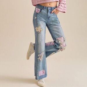 Altar'd State Blue Distressed Flare Jeans with Pink Accents